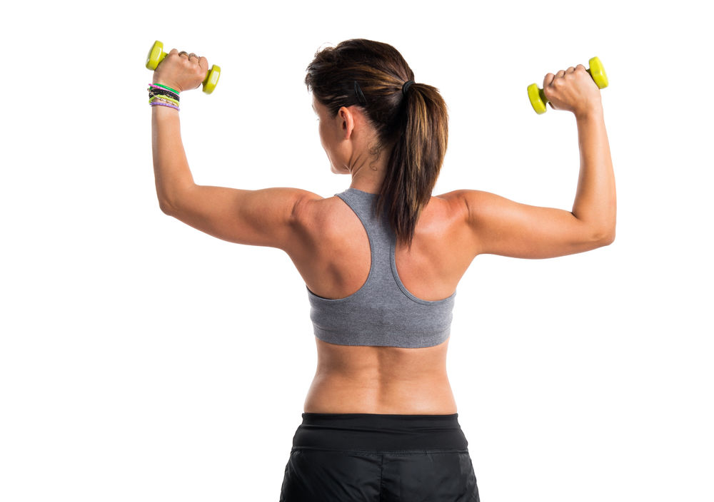 woman doing weightlifting woman build muscle